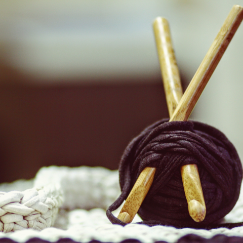 Ball of yarn with two crochet hooks in it